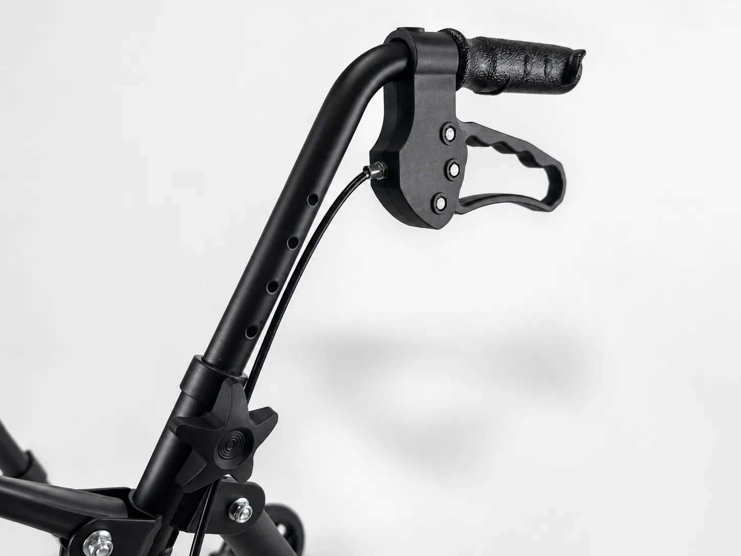 Close-up of the EazyFold rollator's height-adjustable handle post, adjustment holes and star-knob clamp.